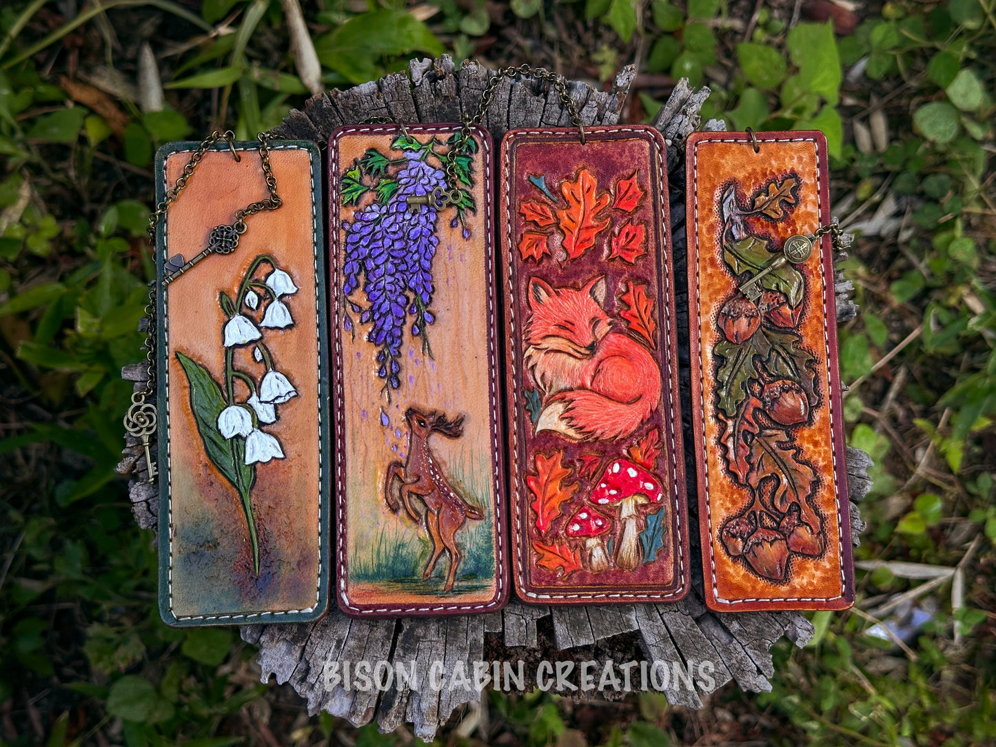 Set of four handmade tooled leather bookmarks featuring woodland designs: owl, red fox, oak leaf, and deer. Crafted from genuine cowhide leather, 13.8 x 4.8 cm and 13.8 x 4 cm sizes. #bookmarks #handmade #Leathertooled #leatherbookmark #leathercarfted #giftforher