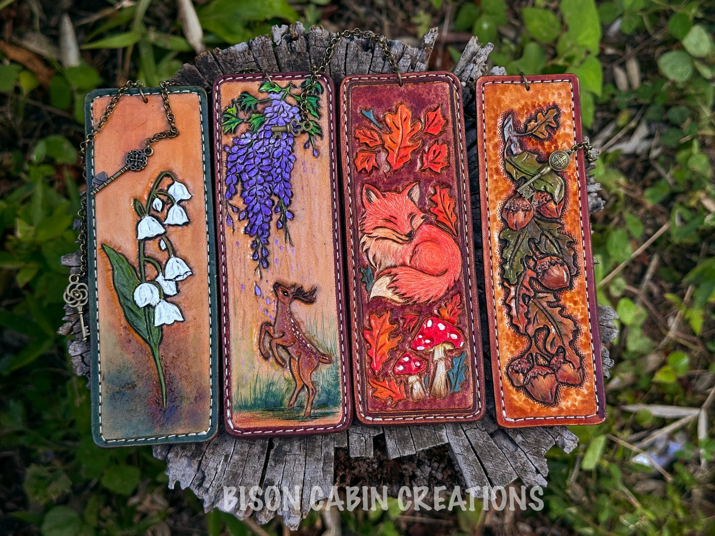 Set of four handmade tooled leather bookmarks featuring woodland designs: owl, red fox, oak leaf, and deer. Crafted from genuine cowhide leather, 13.8 x 4.8 cm and 13.8 x 4 cm sizes. #bookmarks #handmade #Leathertooled #leatherbookmark #leathercarfted #giftforher 
