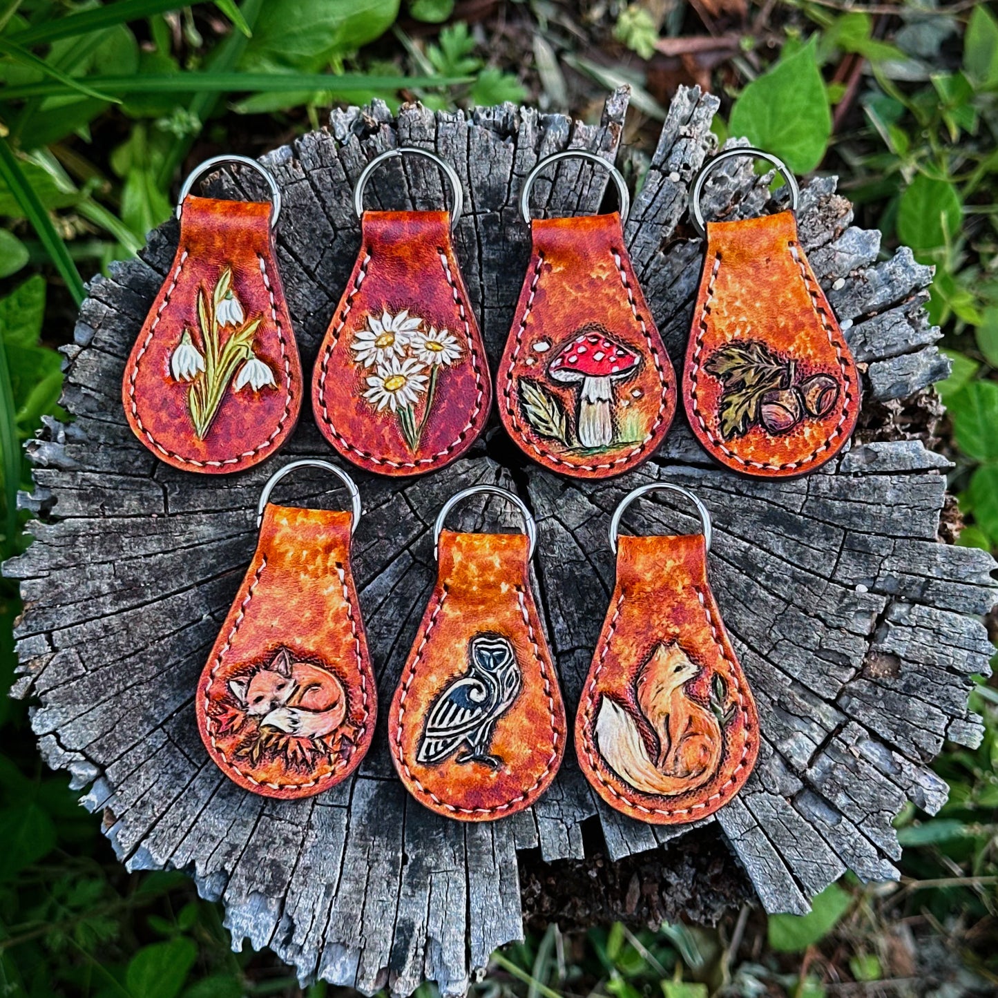  leather tooled keychains with a nature-inspired key chain ring. Woodland and forest core tooled leather key fob 
