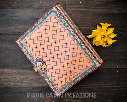 Rustic leather journal cover with colorful cowgirl riding horse, cactus scenery and detailed floral hand tooling design