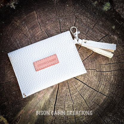 Hand-painted equestrian themed leather wallet with mountains, clouds, and floral tooling, crafted from white textured leather with metal key clip by Bison Cabin 