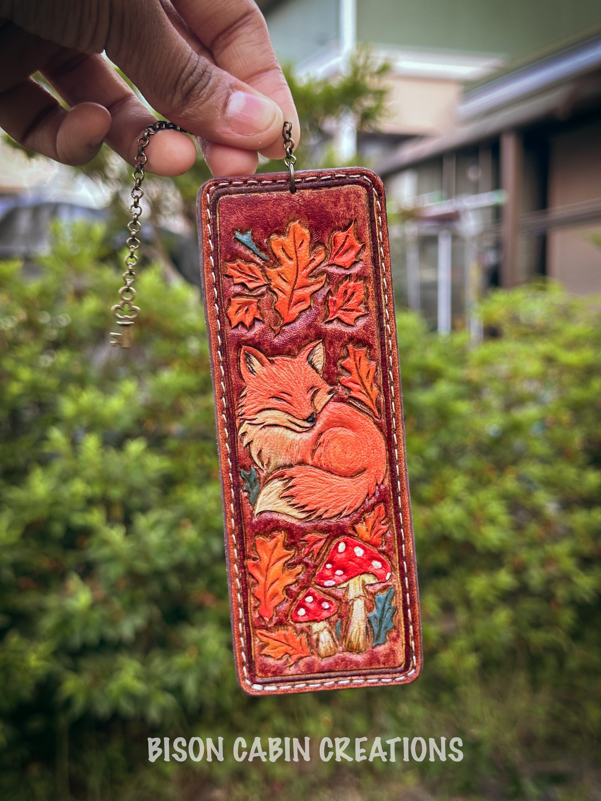 Handmade leather keychain with a fox design, and a tooled Leather bookmark.